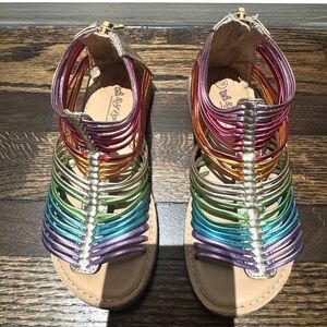 Girls metallic rainbow gladiator sandals.